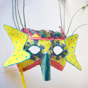 How to make a carnival mask out of cardboard, staples, modroc and a stick.