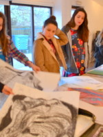 Students at AccessArt's Experimental Drawing Class look through their work