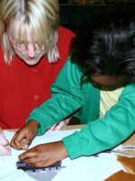 Claire Louise Mather working with a student from St Thomas C of E Primary School, Oldham in Lancashire