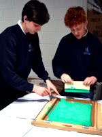 Boys get to work! Andy encourages experimenation and working by trial and error to explore screen printing