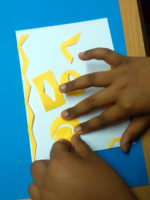 Pupil explores composition with cut out shapes and stencils