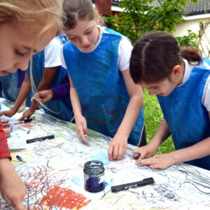 Children make marks in oil pastel