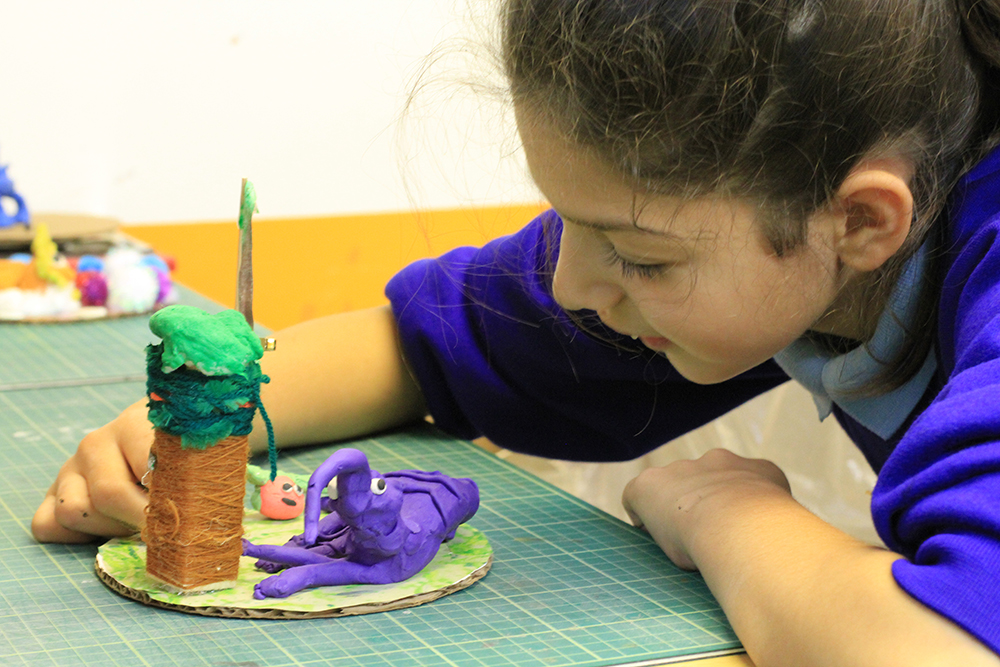 Student with her ant eater sculpture inspired by the Roald Dahl poem The Ant Eater