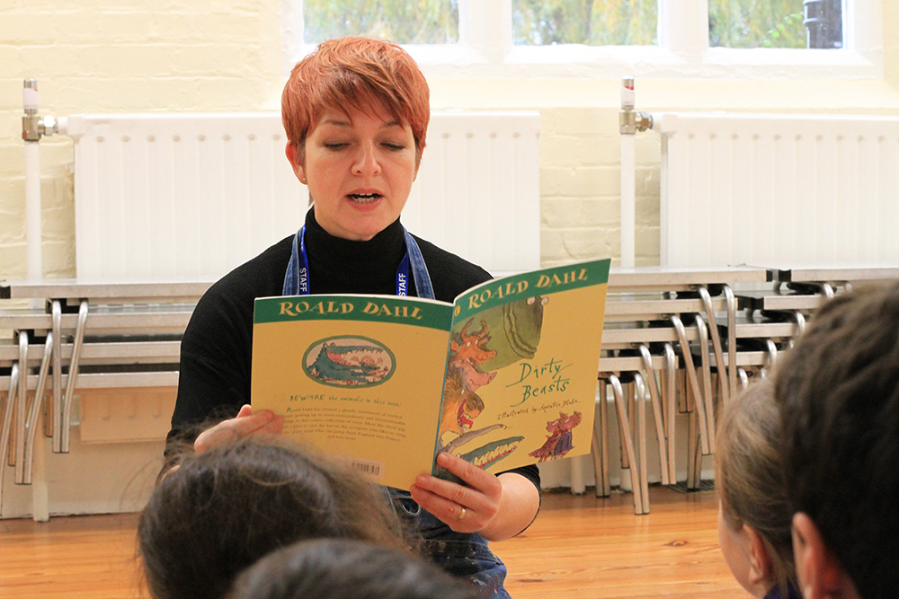 Caption- Sharon Gale reading Dirty Beasts by Roald Dahl to her art club students