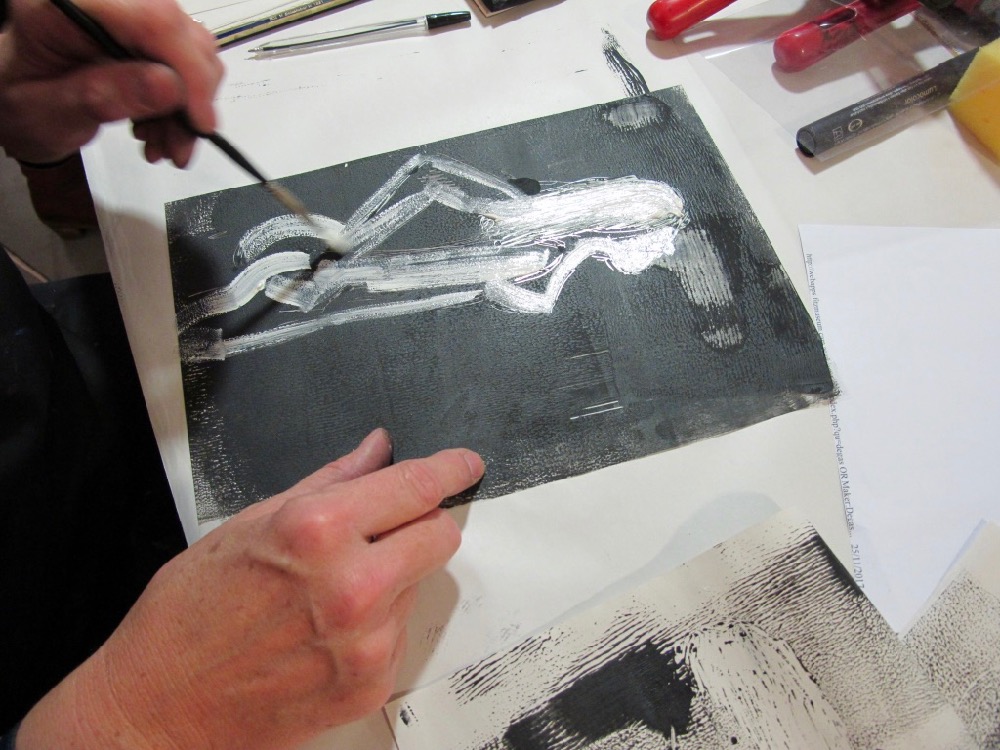 A teacher starts by looking at her drawing etching into her inked up plate - SC Fitz