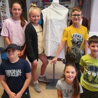 Six, ten year old children - called the Fitzy Peters from Wisbech, Cambridgeshire, posing in front of a mannequin as part of the Inspire Project with the Fitzwilliam Museum, Cambridge and AccessArt - photo by their teacher Natalie Bailey