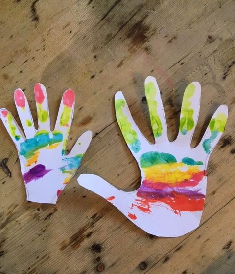 the cut out rainbow hands