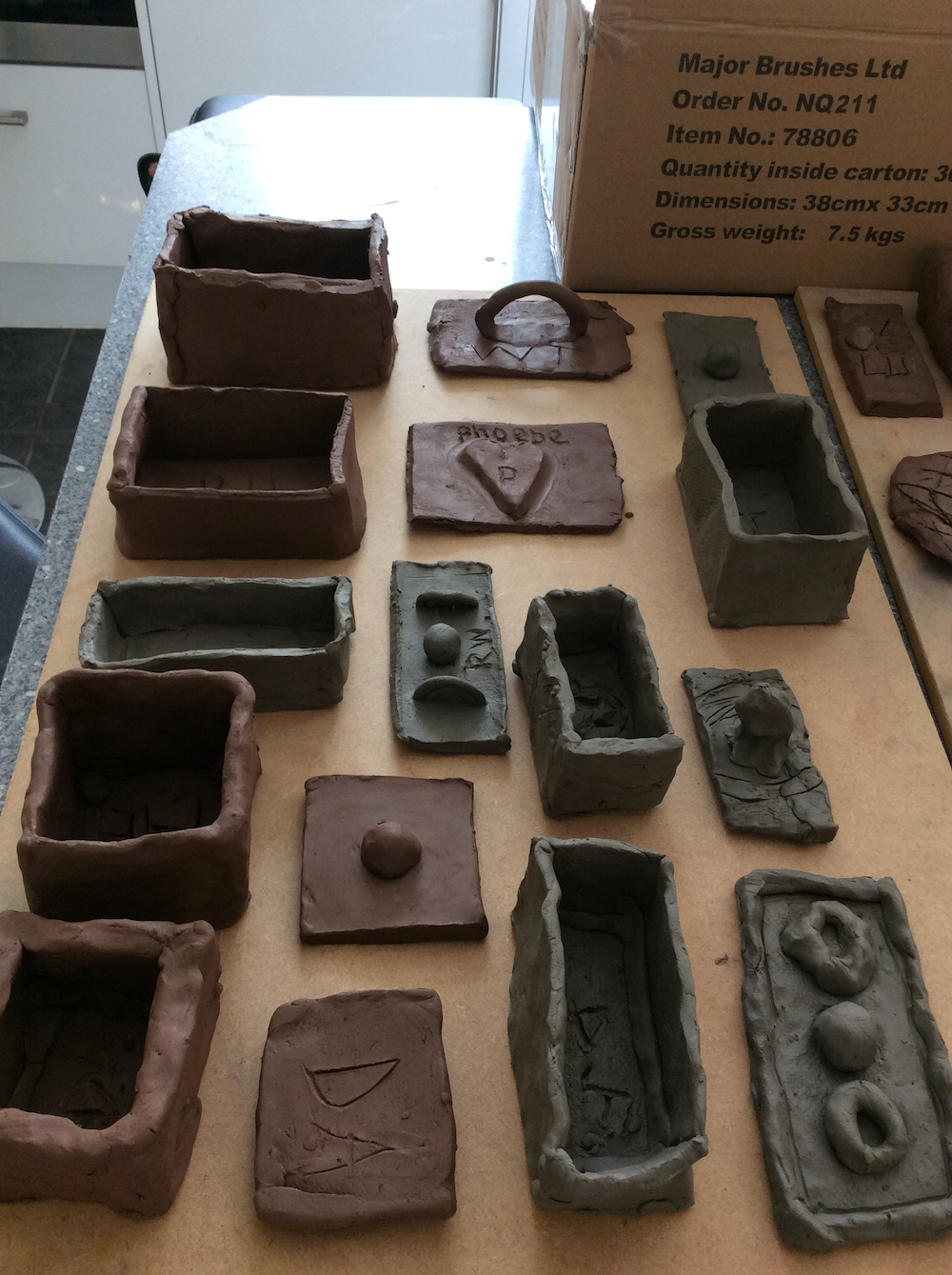 Finished memory boxes made in clay by Year 6 pupils 