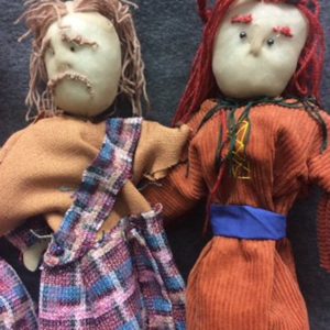 Two puppets showing variation achieved through different costume designs