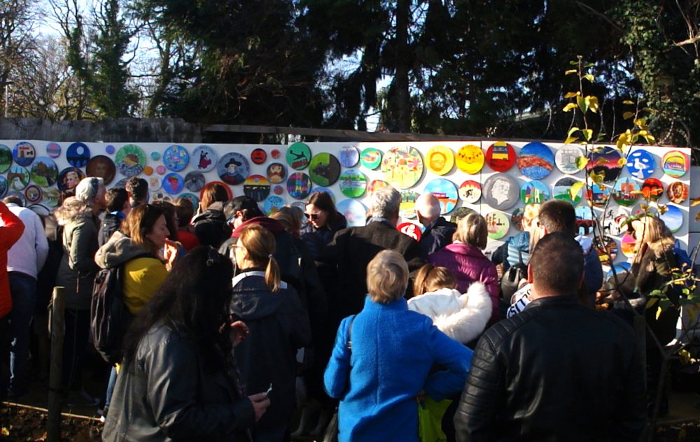 crowds gathered to see the mural unveiled