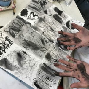 Hands covered in ink