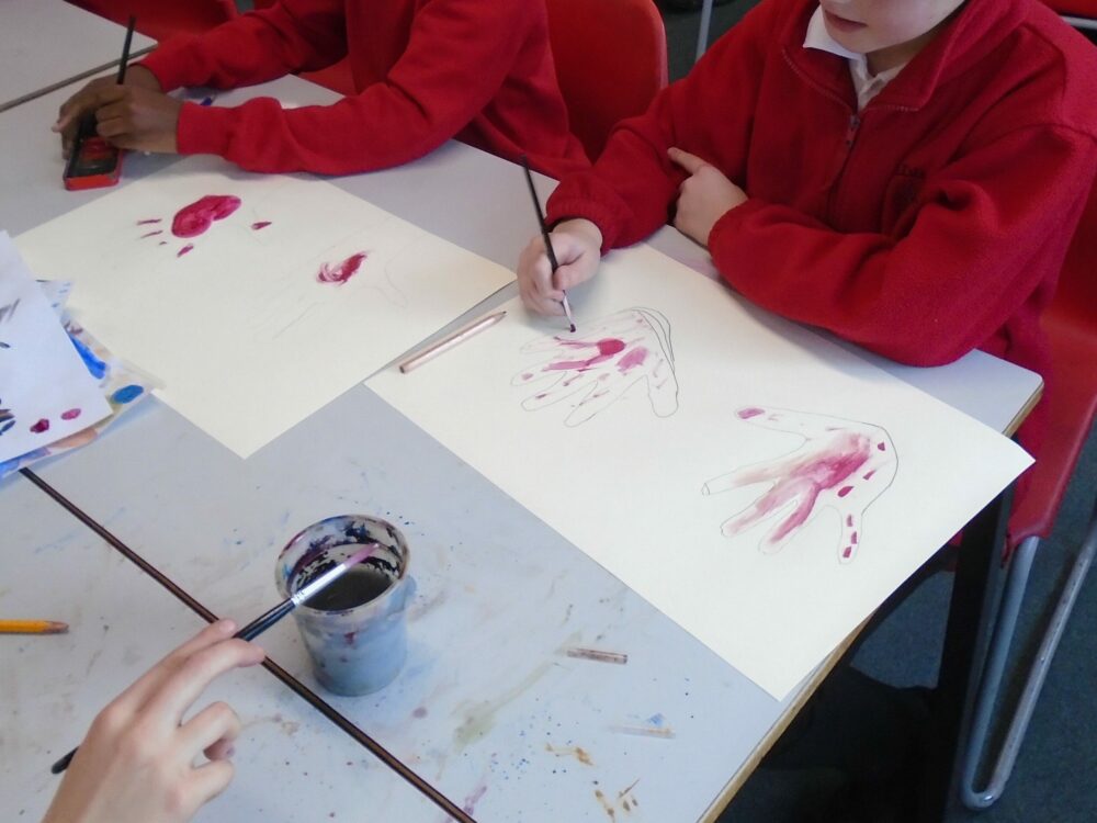 Using red water colour as 'blood on hands'