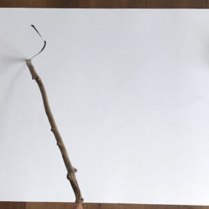 Elizabeth Hammond demonstrates how to draw using a stick to give life to the marks made.