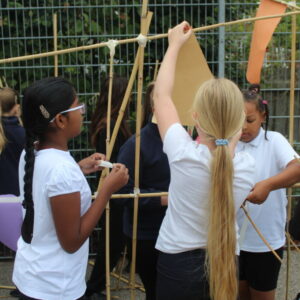 Hanging shapes to a large line made from bamboo canes