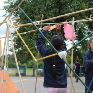 Children Making An Outdoor Installation From Bamboo by Will Downes