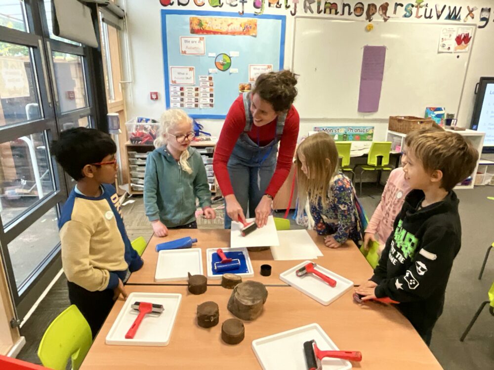 A group of children taking part in an art activity.